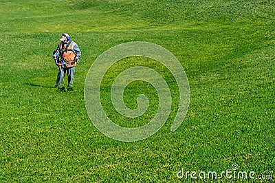 Lawn care. Cutting grass. Editorial Stock Photo