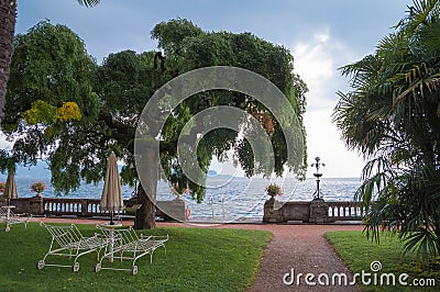 Lawn with lounge chairs overlooking the lake Stock Photo