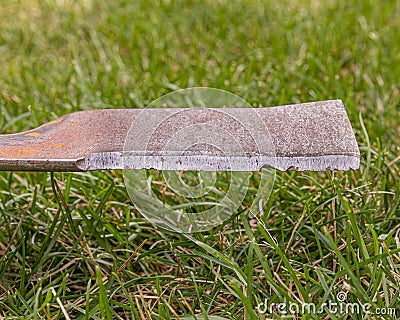 Lawn mower blade worn and dull needing sharpened Stock Photo