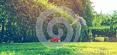 Lawn mower mower grass equipment mowing gardener care work tool Stock Photo