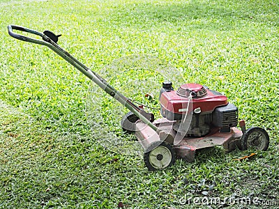 Lawn mower on green grass Stock Photo