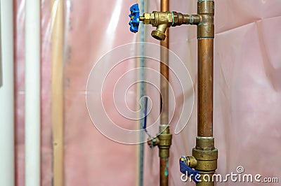 Lawn spinkler shut off valve inside residential basement Stock Photo