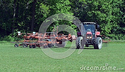 Lawn tractor mows the lawn Stock Photo