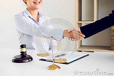 Lawyer is currently shaking hands with the client about the success in resolving the case Stock Photo