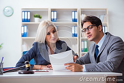 The lawyer discussing legal case with client Stock Photo