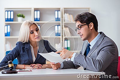 The lawyer discussing legal case with client Stock Photo