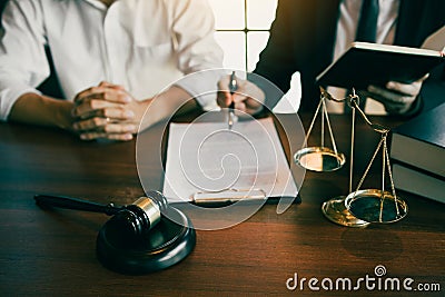 Lawyer explained to the client about the legal issues that must be taken in court in the office Stock Photo