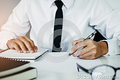 The lawyer, hand writing civil and criminal indictment on the desk at the office Stock Photo