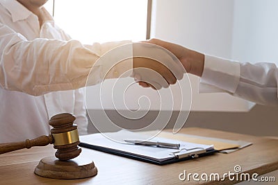 Lawyer handshake. Lawyer people shaking hands with client, finishing up a meeting,Success agreement negotiation Stock Photo