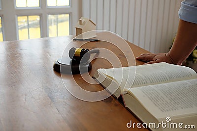 lawyer with law book, judge gavel & house model. real estate dis Stock Photo