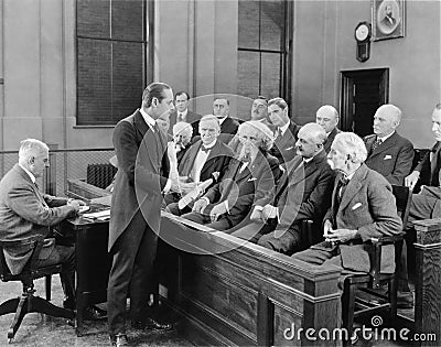 Lawyer talking to jurors Stock Photo