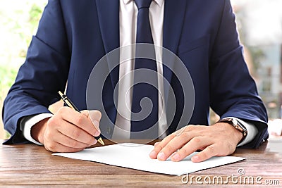 Lawyer working with documents at table Stock Photo