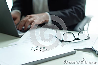 Lawyer working in office. Attorney writing a legal document. Stock Photo