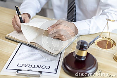 Lawyers or judges sign documents in accordance with legal and fair terms of agreement Stock Photo