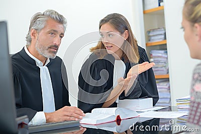 Lawyers talking with client Stock Photo