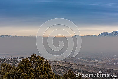 Thick Layer of Smog With Mountain Tops Rising Above Stock Photo