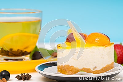 Layered creamy mousse cake with fruit topping Stock Photo