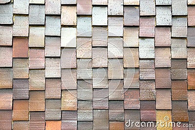 Layered multicolor tiled wall structure with overlapping rectangular elements Stock Photo