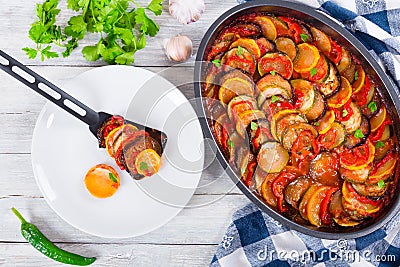 Layered ratatouille in a baking dish, top view Stock Photo