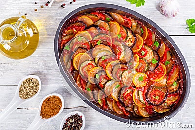 Layered ratatouille in a baking dish, top view Stock Photo