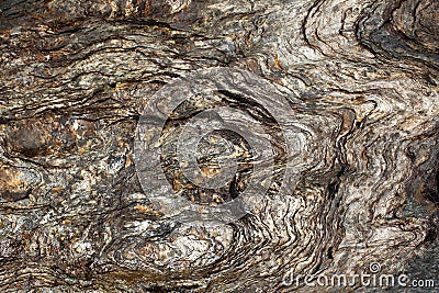 Layers of slate stone eroded by water Stock Photo