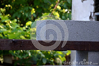 Laying cinder block on the metal corners in the place of the doorway. Stock Photo