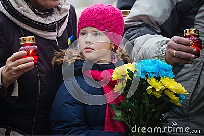 Laying flowers at the memorial cross in the Alley of Heroes Editorial Stock Photo