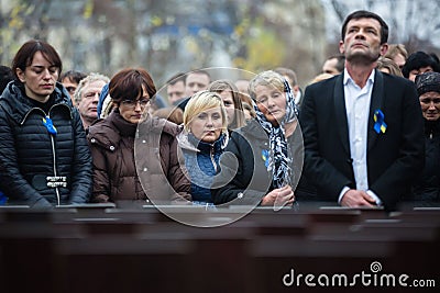 Laying flowers at the memorial cross in the Alley of Heroes Editorial Stock Photo