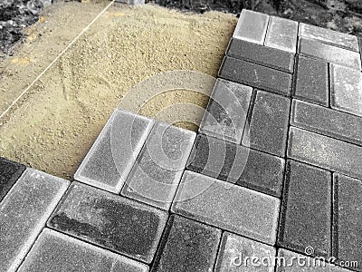 Laying gray paving slabs Brick, close-up Stock Photo
