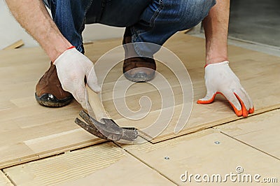 Laying hardwood parquet. Stock Photo