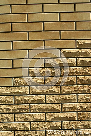 Wall of light smooth and uneven bricks Stock Photo