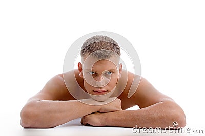 Laying muscular male looking at you Stock Photo