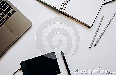 Layout for illustrators, designers, artists with a laptop, a graphic tablet with a stylus and a notepad with pencils. Stock Photo