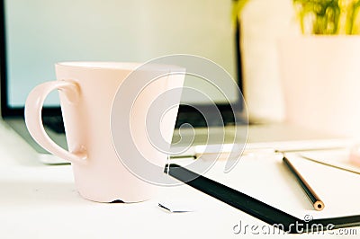 The layout template, laptop, office Desk with a tablet, a smartphone and a Cup of tea. Top view with copy space Stock Photo
