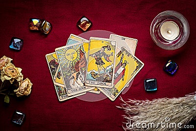 lays out tarot cards, candle, crystal on red background Flat lay Top view Fortune telling, prediction, esoteric, tarot cards Stock Photo