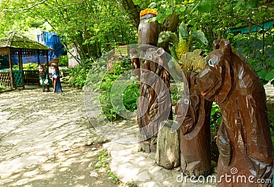 LAZAREVSKOE, SOCHI, RUSSIA - MAY, 29, 2021: Wooden figurine of three bears in the recreation area of Berendeyevo Kingdom Editorial Stock Photo