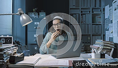 Lazy employee yawning in the office Stock Photo