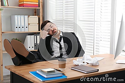 Lazy employee sleeping at table Stock Photo