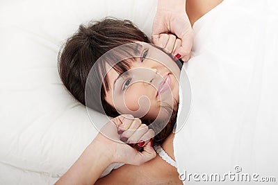 Lazy woman in bed Stock Photo