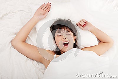 Lazy woman in bed Stock Photo