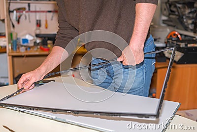 LCD TV repair, disassembly of the screen to replace the backlight Stock Photo