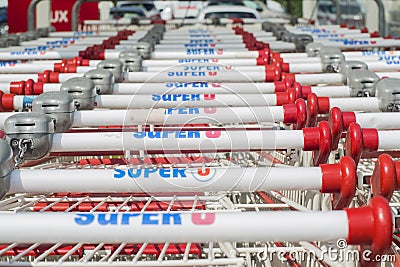 LE MANS, FRANCE-JULY 25, 2017: Row of many push cart of french mark Super U Editorial Stock Photo