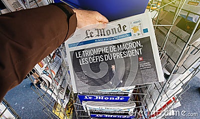 Le monde with President`s Challenges Emmanuel Macron after elect Editorial Stock Photo