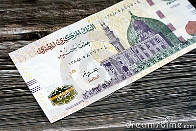 200 LE two hundred Egyptian pounds banknote series 2022 features Qani-Bay mosque in Cairo Egypt and The seated scribe, selective Stock Photo