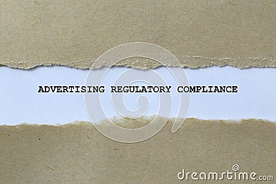 advertising regulatory compliance on white paper Stock Photo