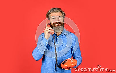 Lead generation specialist. Sales script. Bearded man phone conversation. Retro phone. Outdated technology. Manager Stock Photo