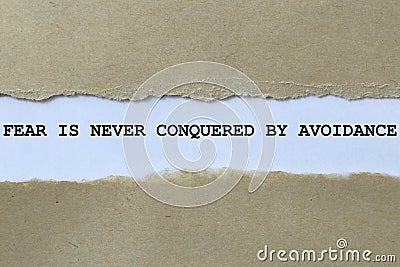 fear is never conquered by avoidance on white paper Stock Photo