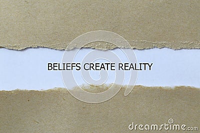 beliefs create reality on white paper Stock Photo