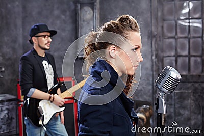 Lead singer stands at microphone Stock Photo