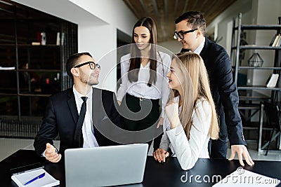 Leader asking team about laptop presentations. Stock Photo